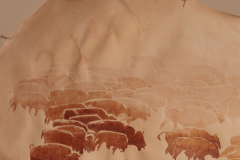 A detail of the "Great Migration" where the brand can be seen in the hide used to create this piece of art.